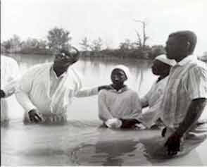Photo of a river baptism